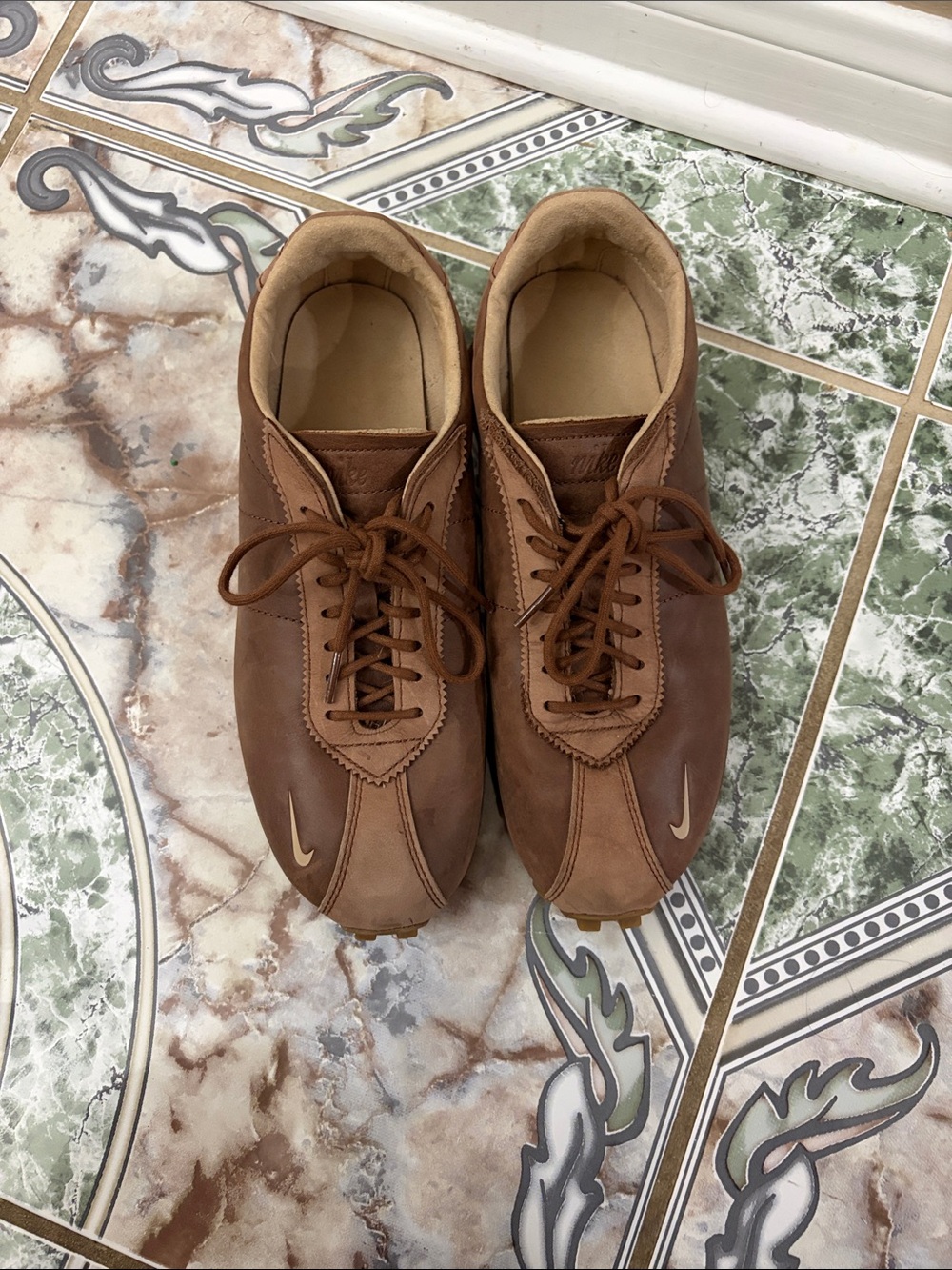 Nike Womenโs Brown Leather Lace-Up Sneakers